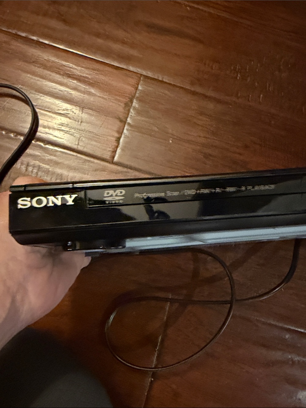 Sony black DVD player with glossy finish